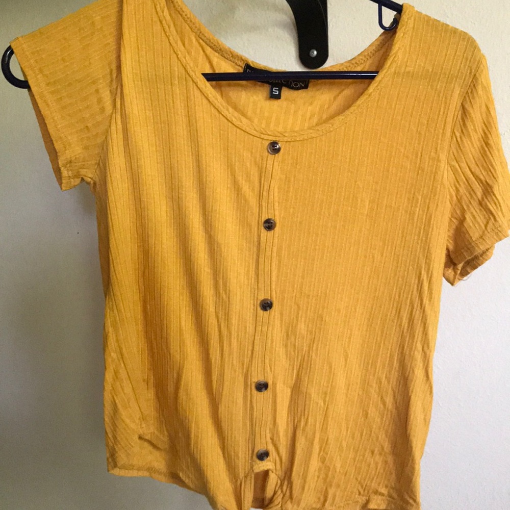 A yellow flowy shirt